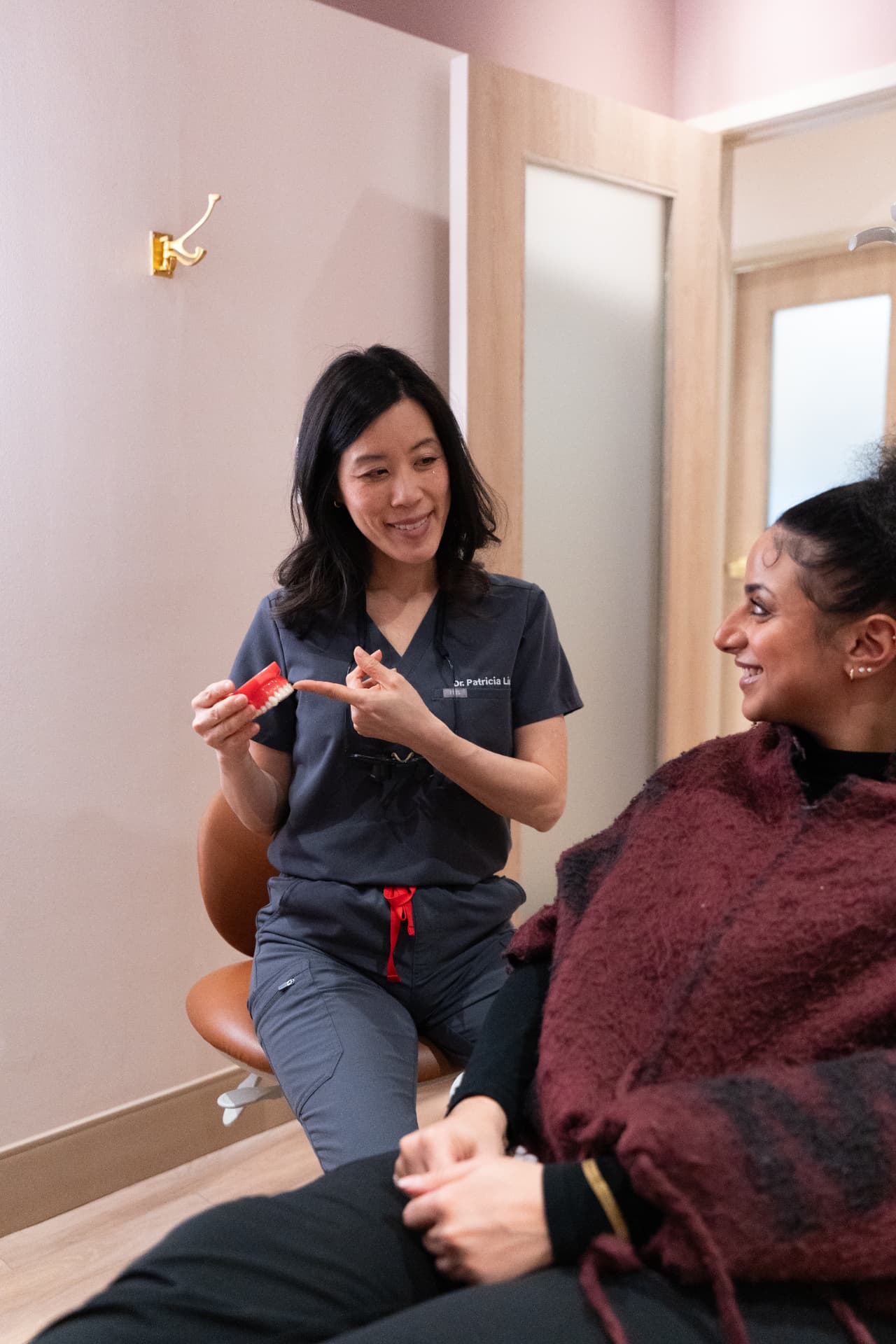 Dr. Patricia Liu explaining a treatment to a patient